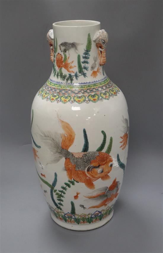 A Chinese famille verte vase, with twin elephant handles and decorated with shubunkins, restored height 22cm